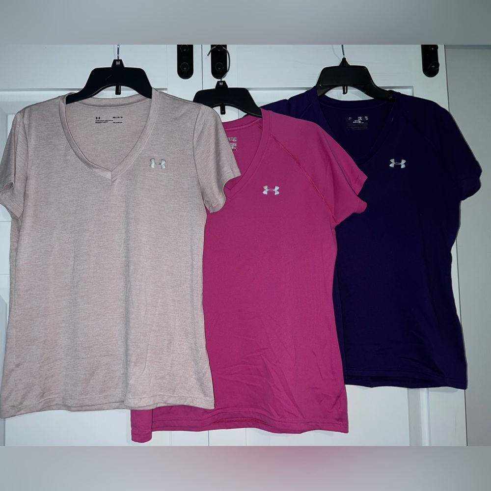 (3) pack shirts - UnderArmour. Dry fit, V-neck shirts. Women’s M